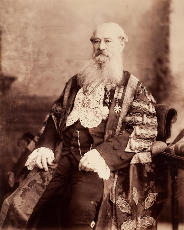 Portrait of former Vice-Chancellor Sir Anthony Brownless wearing embroidered robes with medals and a wide lace bib and cuffs.