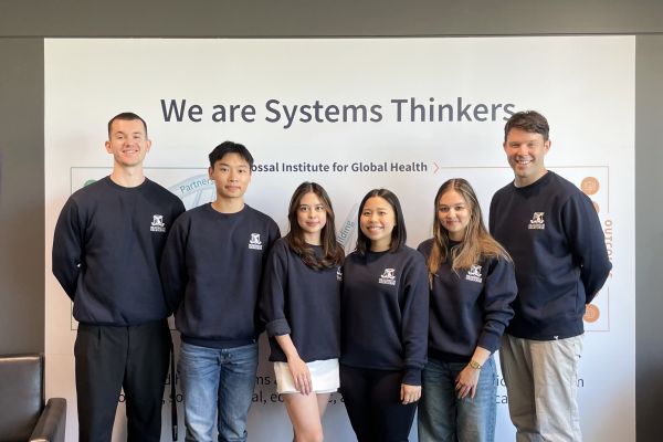 University of Melbourne team smiling at the camera: Kieran Benn, Samantha Eala, James Puckridge, Jessica Andriani Putrono, Planning Saw, and Cara Siren from the Faculty of Medicine, Dentistry and Health Sciences.