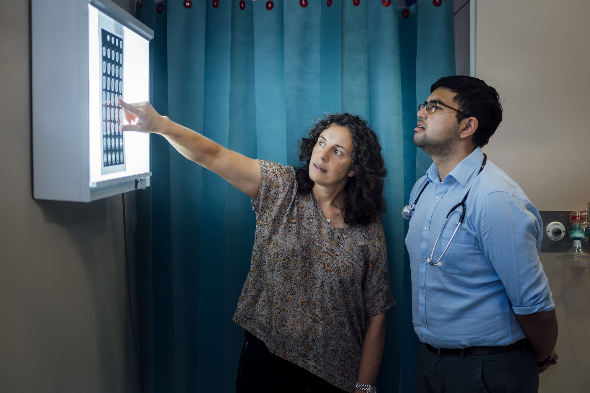 Dr Christine Sammartino and student Farhan Islam look at...