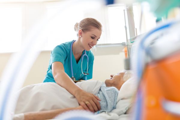 Nurse cares for elderly patient