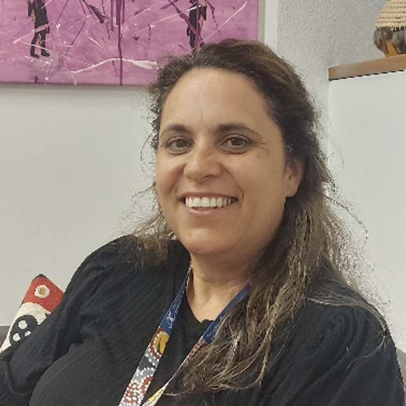 Woman in black smiling at camera