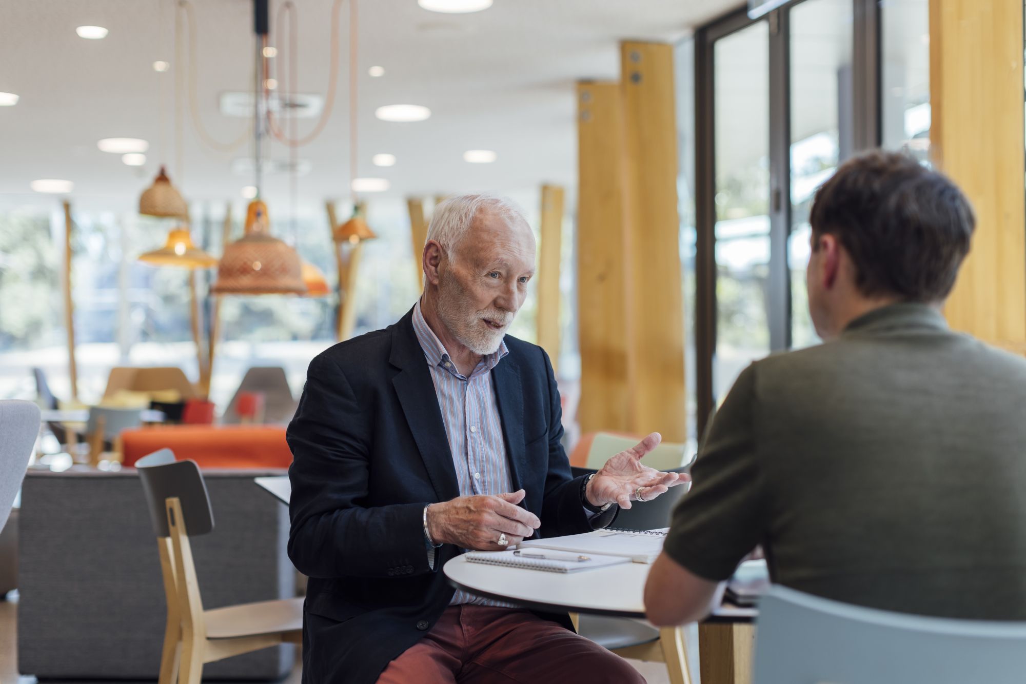 Pat McGorry talks with a colleague at Orygen