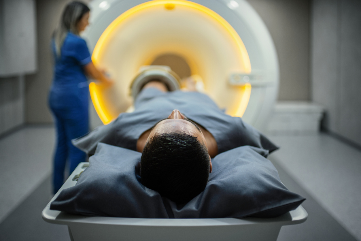 Patient entering MRI as technician starts the procedure.