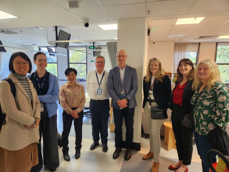 Group photo of people standing in a semi circle at Doherty Clinical Trials