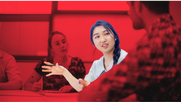Group of students sitting around a new desk discussing research