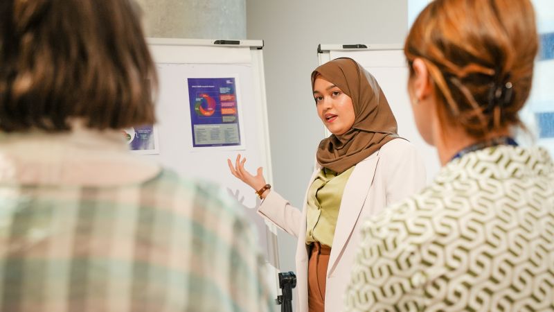A participant in the Connect 4 Innovation Challenge presents her research.